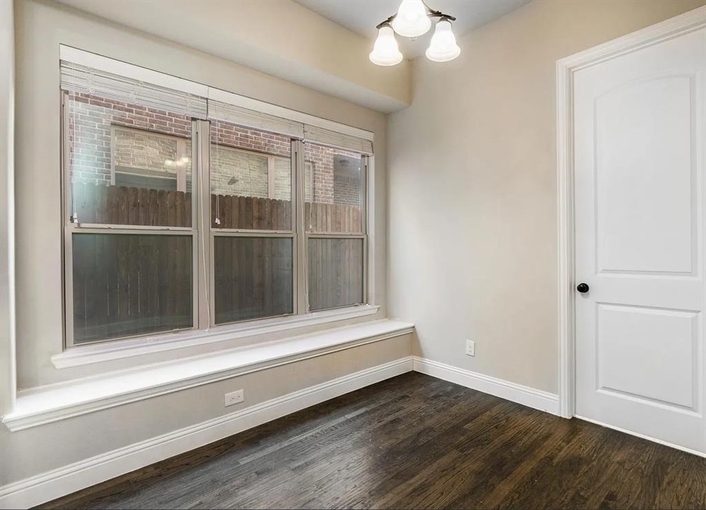 5215 Wakefield Drive Irving, TX 75038 - Photo 18 of 36 a view of empty room with wooden floor and fan