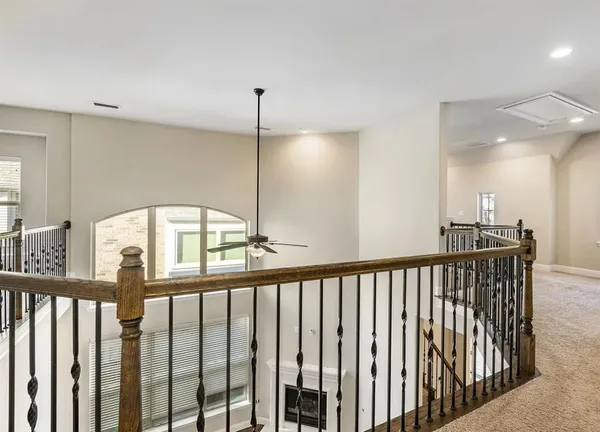 a view of a hallway with windows