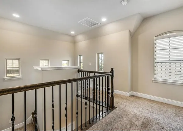 a view of a hallway with windows