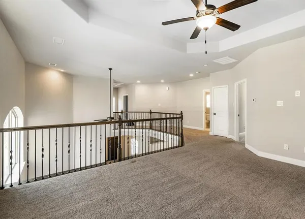 a view of a hallway with a chandelier