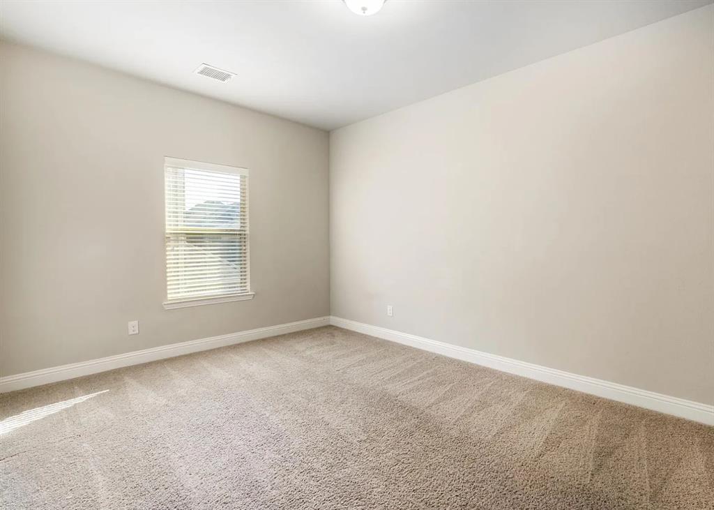 5215 Wakefield Drive Irving, TX 75038 - Photo 27 of 36 an empty room with windows