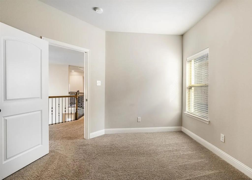 5215 Wakefield Drive Irving, TX 75038 - Photo 30 of 36 an empty room with windows