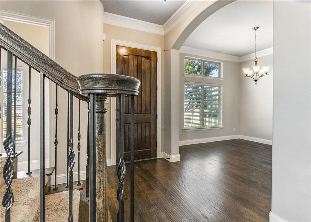 5215 Wakefield Drive Irving, TX 75038 - Photo 5 of 36 a view of an entryway with wooden floor and door