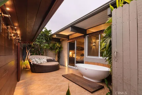 a kitchen with stainless steel appliances granite countertop a sink and a refrigerator