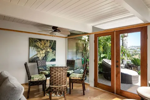 a bedroom with a bed and a mirror