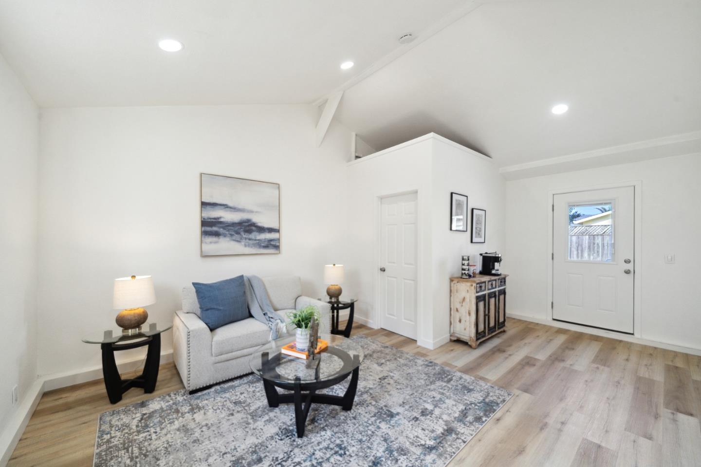 1324 Peralta Road Pacifica, CA 94044 - Photo 17 of 25 a living room with furniture and wooden floor