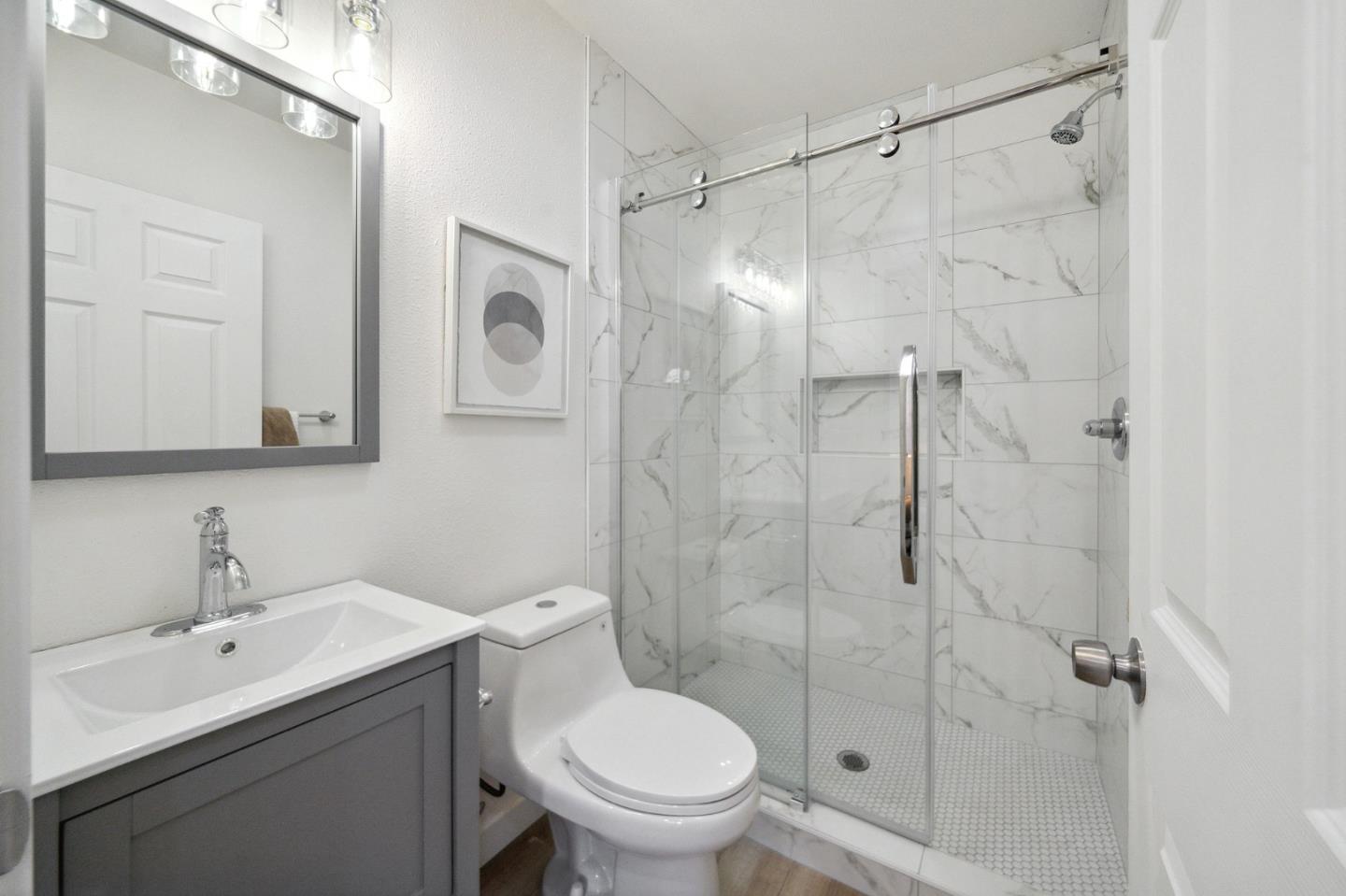 1324 Peralta Road Pacifica, CA 94044 - Photo 19 of 25 a bathroom with a toilet sink shower and mirror