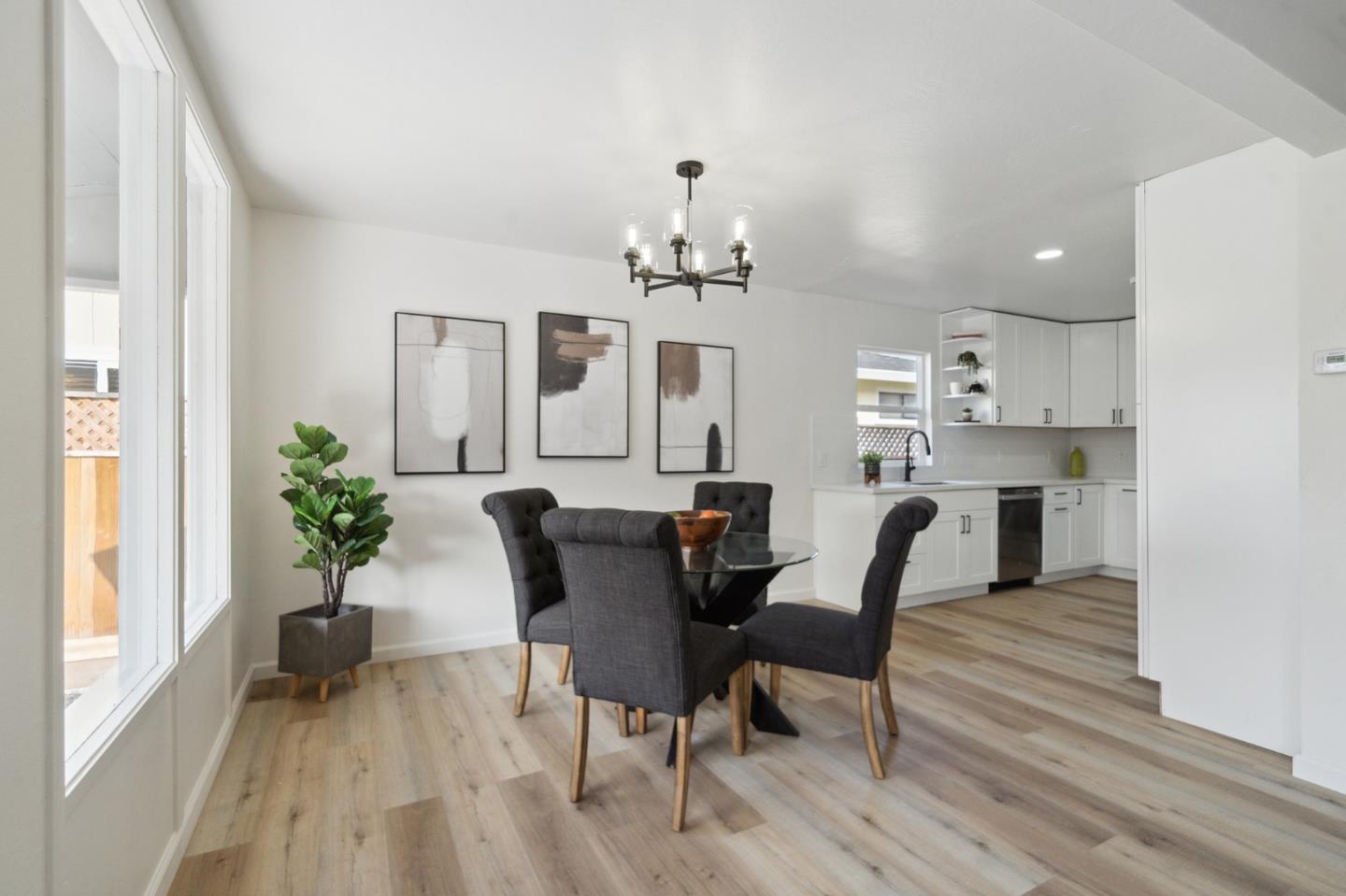1324 Peralta Road Pacifica, CA 94044 - Photo 5 of 25 a view of a dining room with furniture and wooden floor