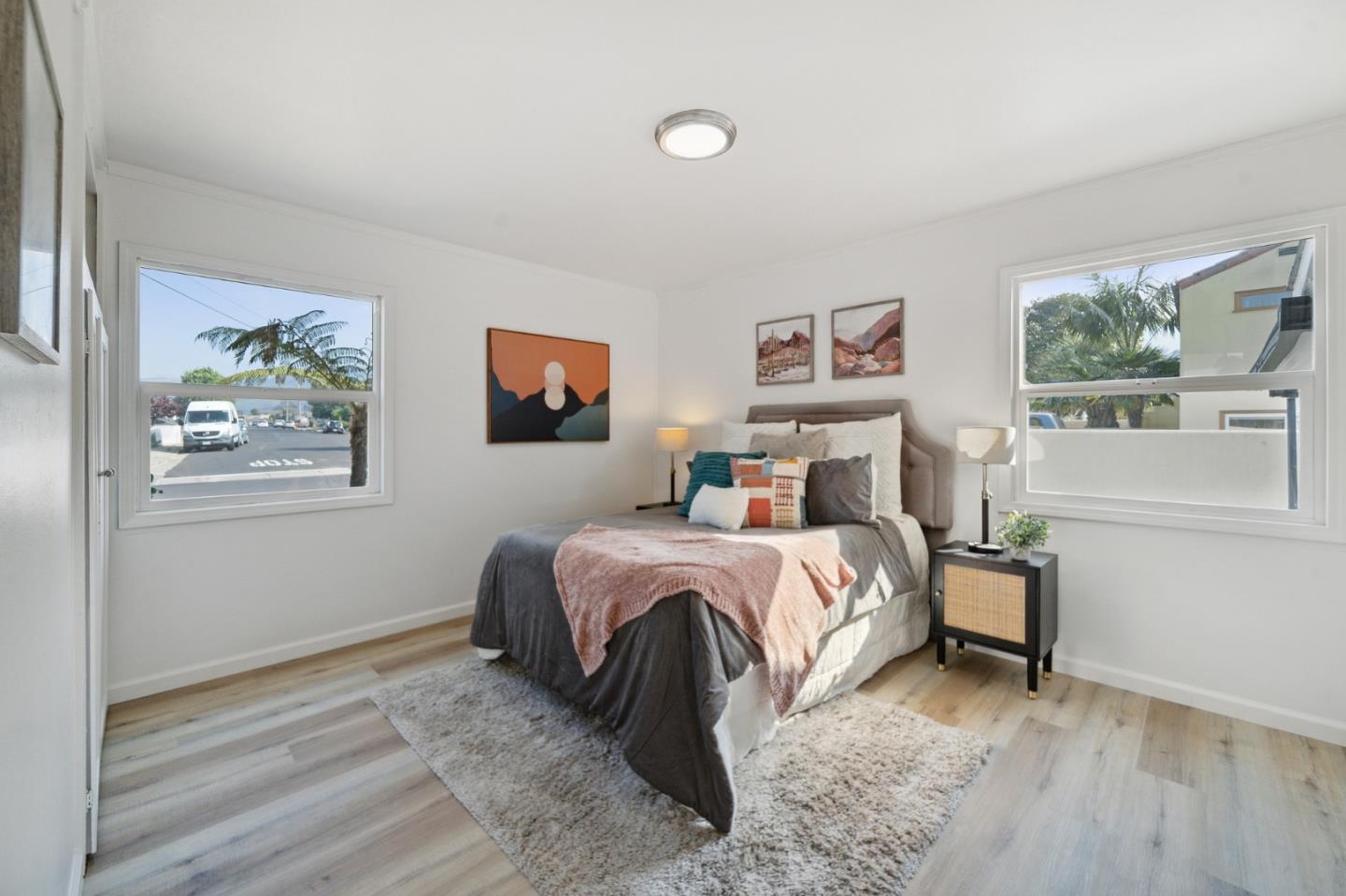 1324 Peralta Road Pacifica, CA 94044 - Photo 10 of 25 a bedroom with a bed and a painting on the wall