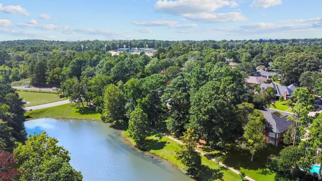an aerial view of a houses with a yard