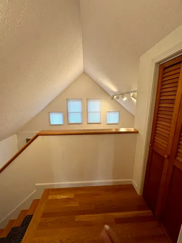 a view of balcony with wooden floor