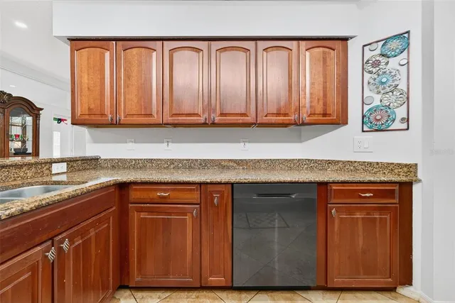 a bathroom with a sink and mirror with toilet