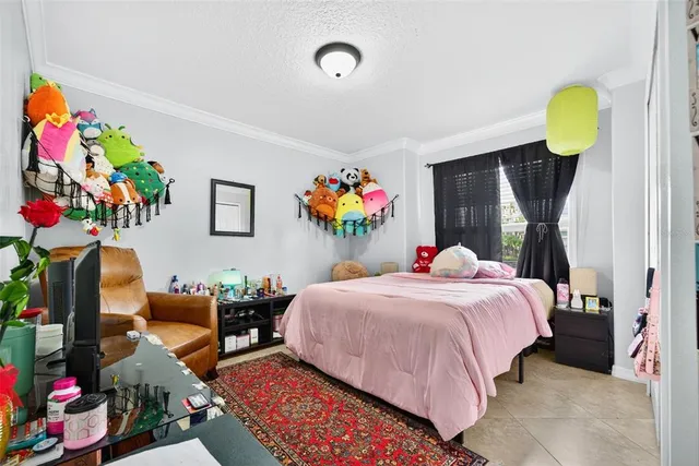 a view of a house with a backyard and a tree