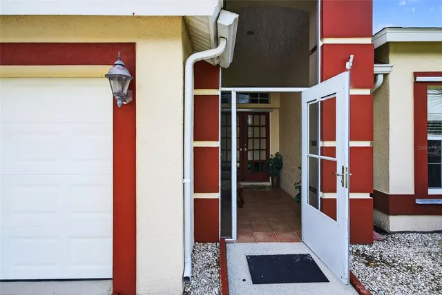 a living room with furniture and flowers