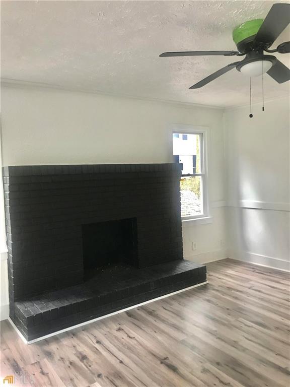 116 Edwards Street Bremen, GA 30110 - Photo 13 of 33 a view of wooden floor and windows in a room