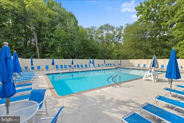 a view of a swimming pool with a lounge chairs