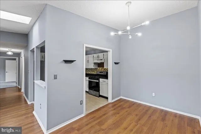 a view of a kitchen from the hallway