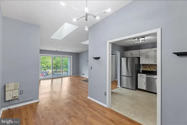 a view of a kitchen with a stove cabinets and a wooden floor