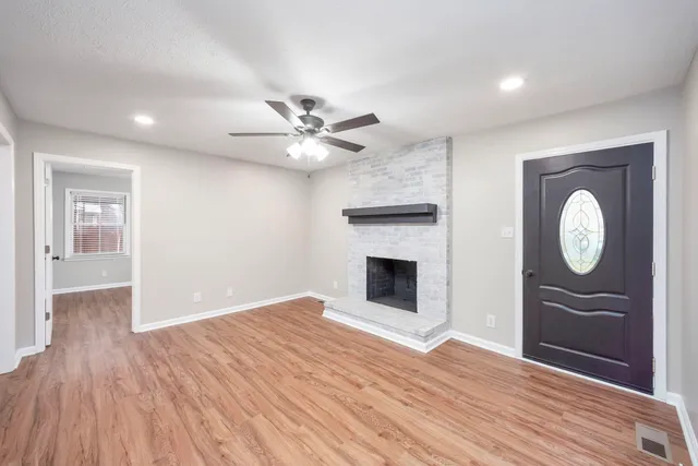 a view of a livingroom with wooden floor