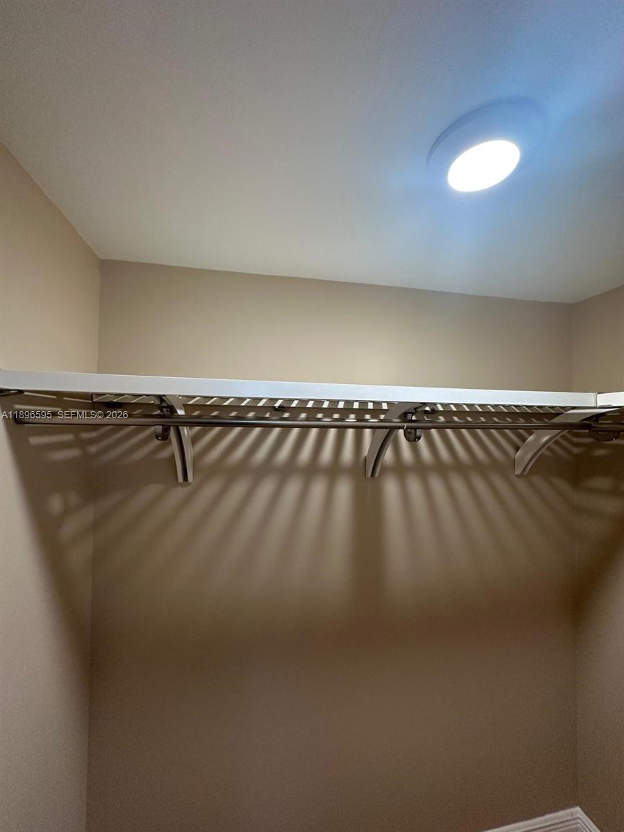 9848 Marina Boulevard, Unit 811 Boca Raton, FL 33428 - Photo 58 of 86 Master bedroom walk in closet