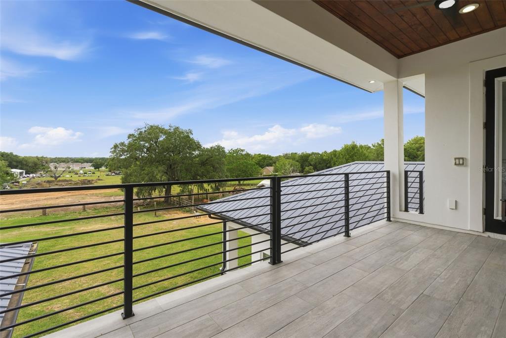 8241 Cass Road Zephyrhills, FL 33540 - Photo 48 of 97 a view of a balcony with chairs