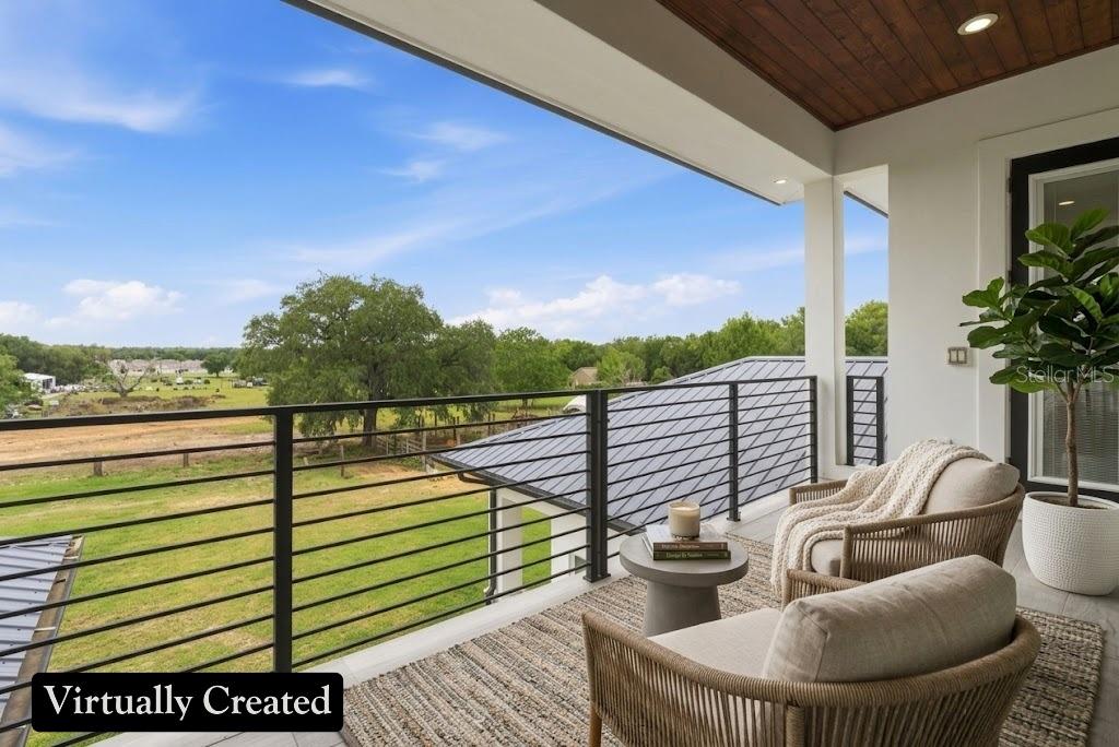 8241 Cass Road Zephyrhills, FL 33540 - Photo 49 of 97 a view of balcony with couch and potted plants