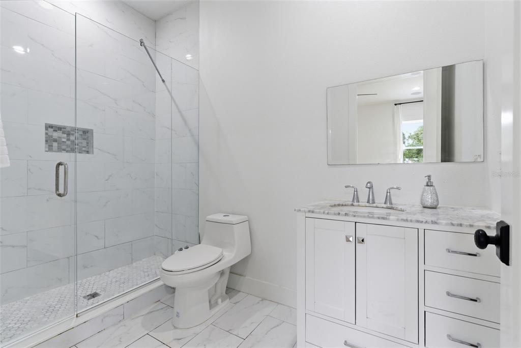 8241 Cass Road Zephyrhills, FL 33540 - Photo 59 of 97 a bathroom with a toilet sink and shower