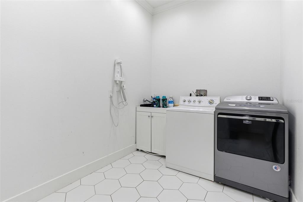8241 Cass Road Zephyrhills, FL 33540 - Photo 61 of 97 a utility room with dryer and washer