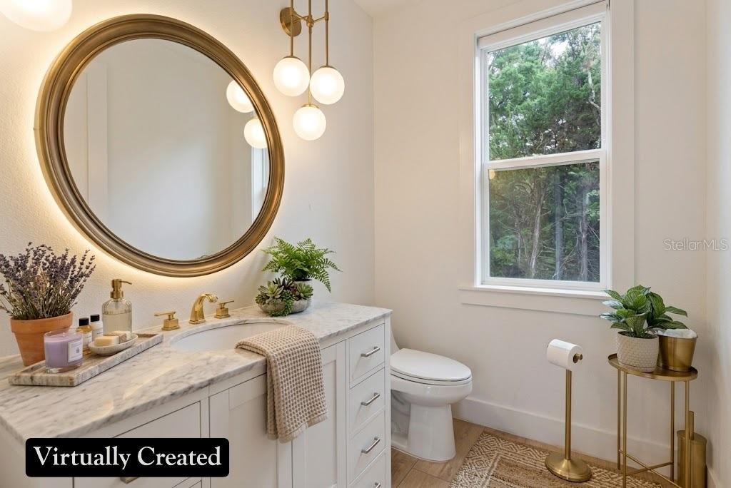 8241 Cass Road Zephyrhills, FL 33540 - Photo 63 of 97 a bathroom with a granite countertop sink and a mirror
