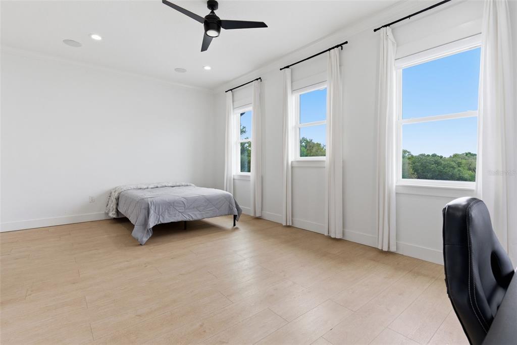8241 Cass Road Zephyrhills, FL 33540 - Photo 68 of 97 a bedroom with a bed and a window