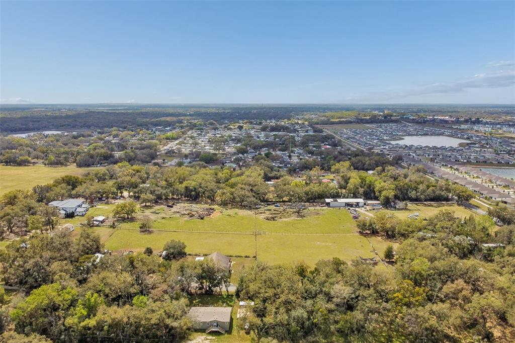 8241 Cass Road Zephyrhills, FL 33540 - Photo 87 of 97 an aerial view of ocean and residential houses with outdoor space