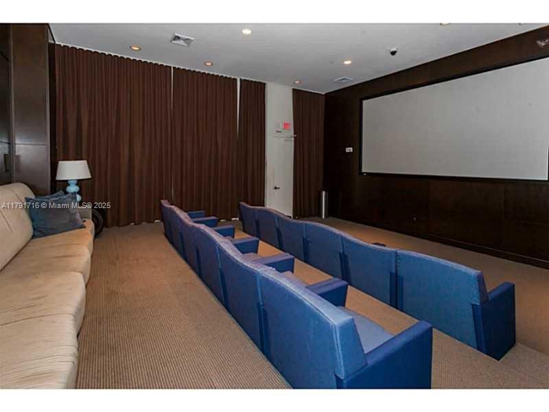 2775 Northeast 187th Street, Unit 311 Aventura, FL 33180 - Photo 13 of 28 a living room with furniture
