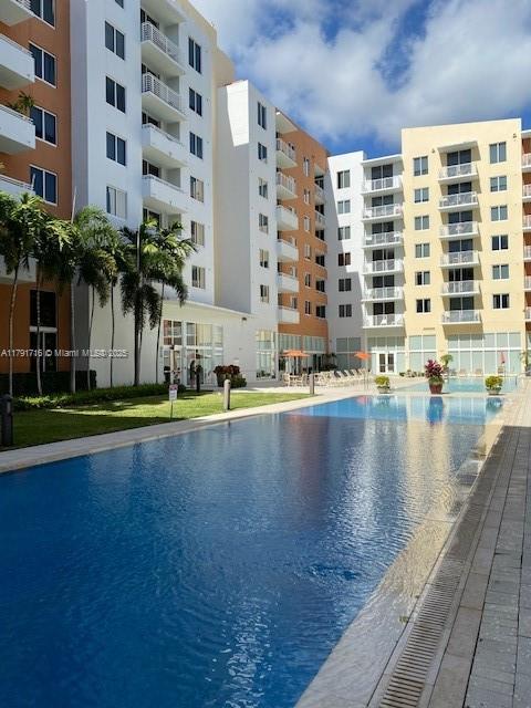 2775 Northeast 187th Street, Unit 311 Aventura, FL 33180 - Photo 17 of 28 a view of building with yard and staircase