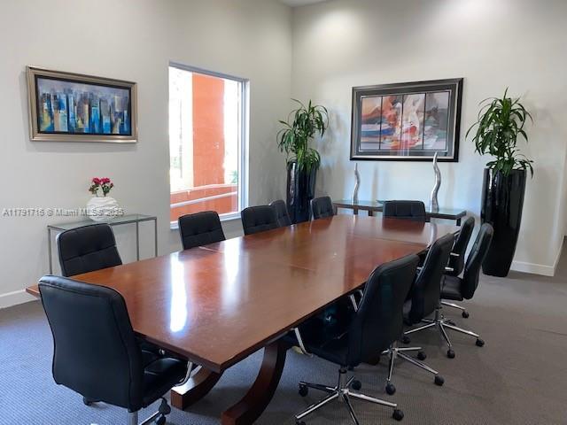 2775 Northeast 187th Street, Unit 311 Aventura, FL 33180 - Photo 20 of 28 a view of a dining room with furniture window and wooden floor
