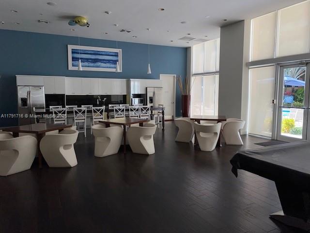 2775 Northeast 187th Street, Unit 311 Aventura, FL 33180 - Photo 24 of 28 a living room with furniture and a large window