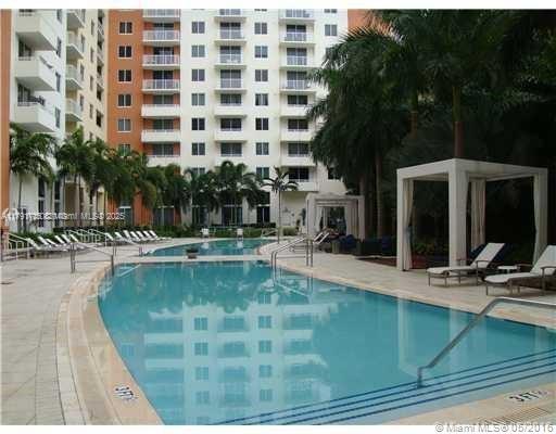 2775 Northeast 187th Street, Unit 311 Aventura, FL 33180 - Photo 25 of 28 a view of a swimming pool with a patio
