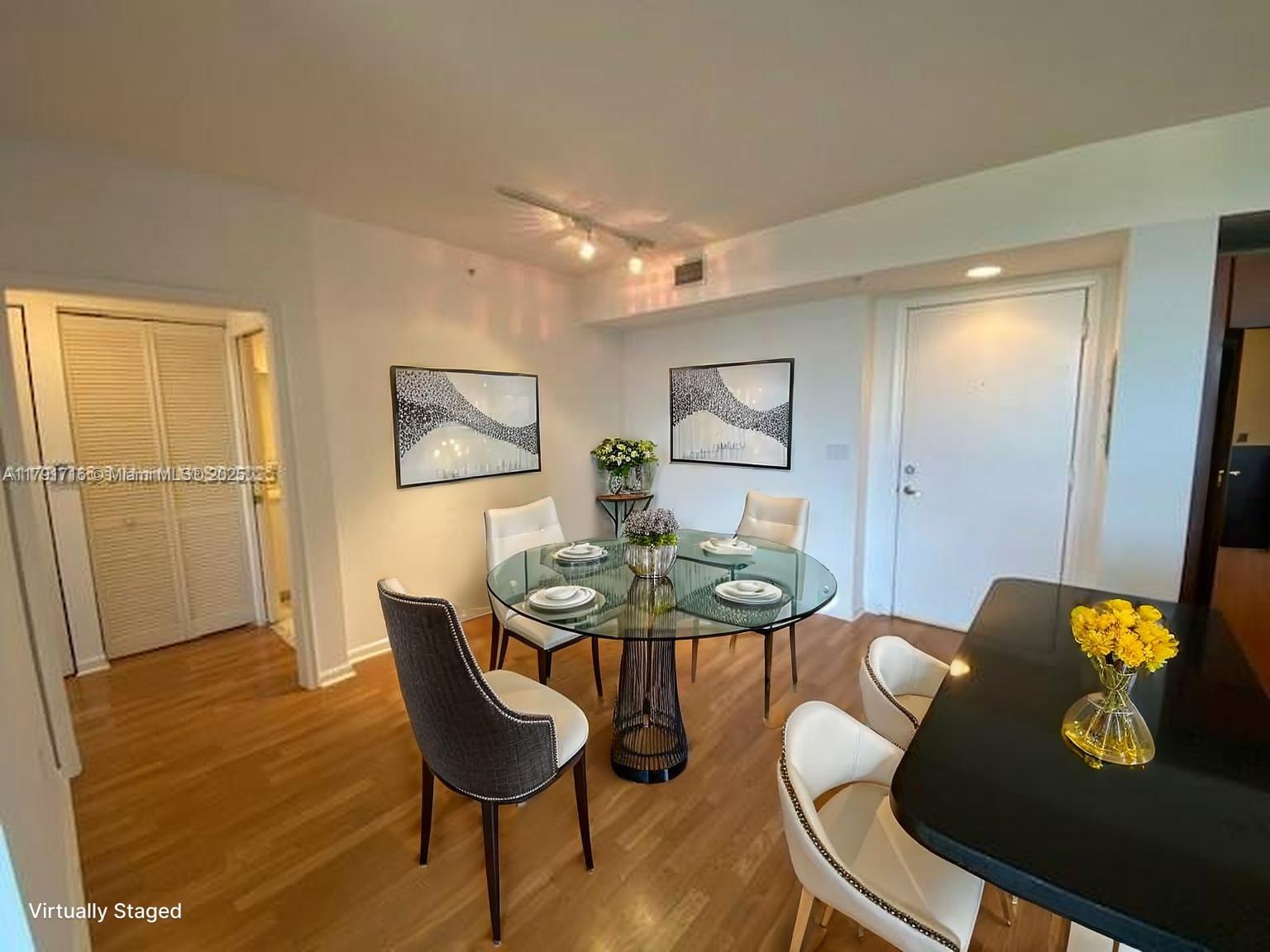 2775 Northeast 187th Street, Unit 311 Aventura, FL 33180 - Photo 3 of 28 a view of a dining room with furniture