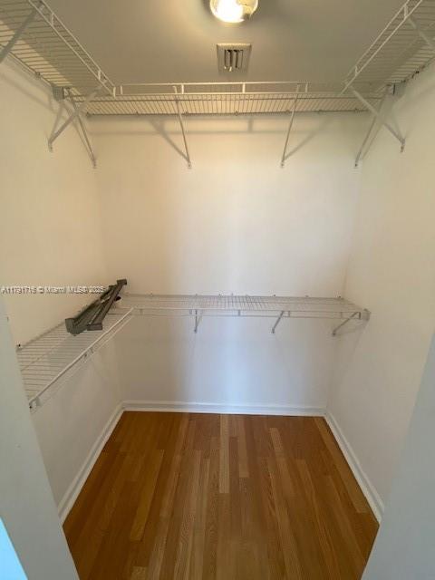 2775 Northeast 187th Street, Unit 311 Aventura, FL 33180 - Photo 9 of 28 a view of a room with racks on the wall