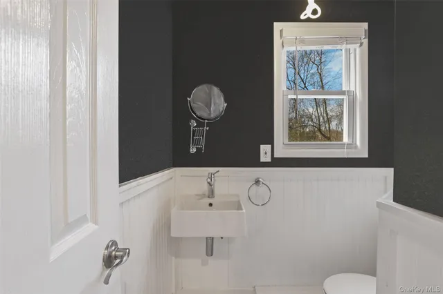a bathroom with a mirror and a shower