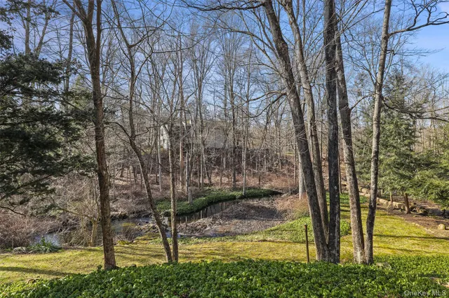 a backyard of apartments with large trees
