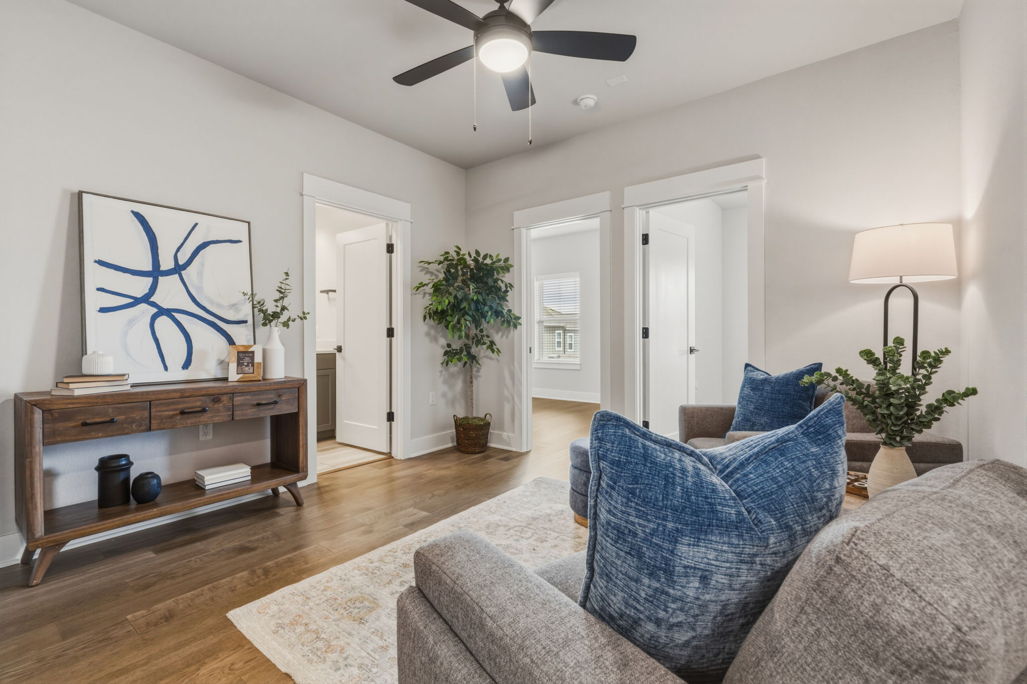 2929 Moreno Street Austin, TX 78723 - Photo 24 of 40 Spacious interior featuring wood-finish flooring, a contemporary ceiling fan, and crisp white trim