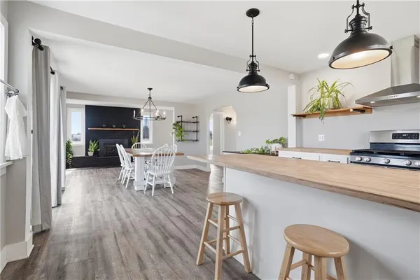 a dining room with furniture and wooden floor