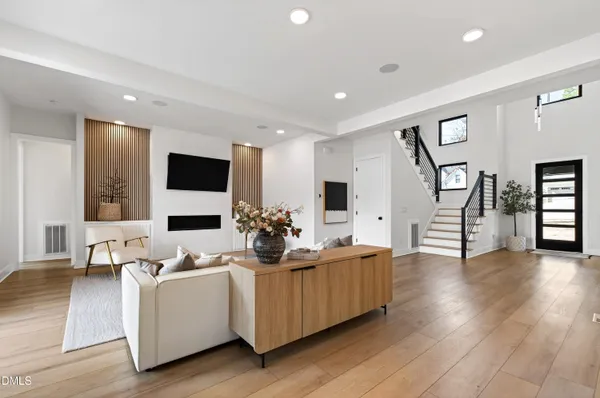 a living room with furniture and a fireplace