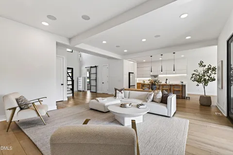 a kitchen with a table chairs sink and cabinets