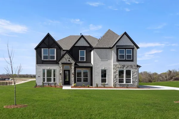 front view of a house with a yard