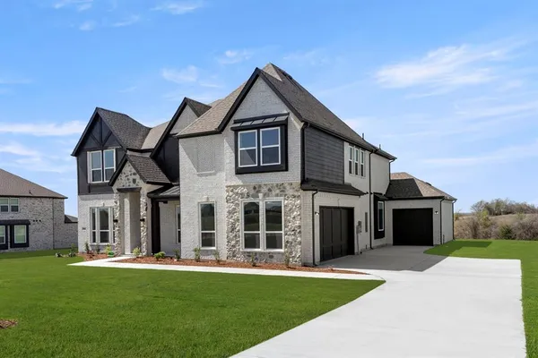 front view of a house with a yard