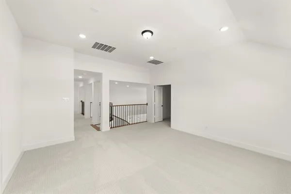 an empty room with white walls and white walls