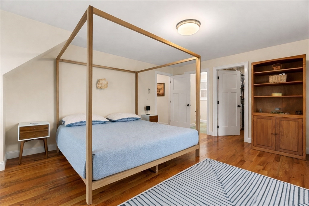 22 Pond Street, Unit 2 Amesbury, MA 01913 - Photo 15 of 40 a bedroom with a bed and a walk in closet
