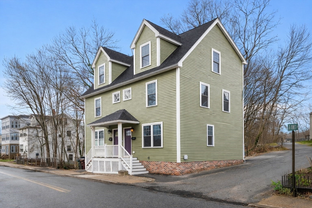 22 Pond Street, Unit 2 Amesbury, MA 01913 - Photo 2 of 40 a front view of a house with a yard