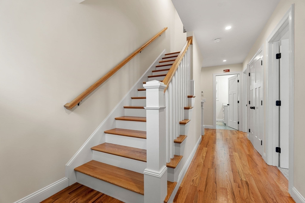 22 Pond Street, Unit 2 Amesbury, MA 01913 - Photo 21 of 40 a view of entryway with wooden floor and stairs